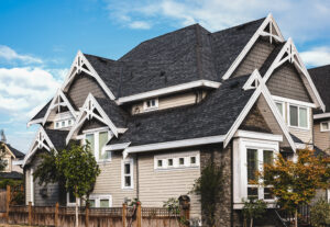 Suburban home with asphalt shingle roof and white trim